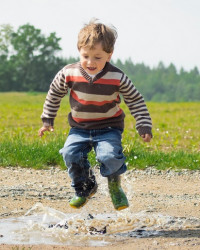 child in puddle